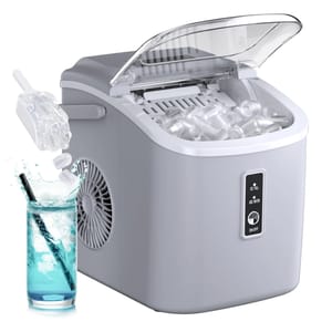 Portable ice maker with a transparent lid, capable of producing 26 pounds of ice, featuring a control panel for \“Ice Full\“ and \“Add Water\“ indicators. Includes a scoop for easy ice transfer next to a glass of blue beverage.
