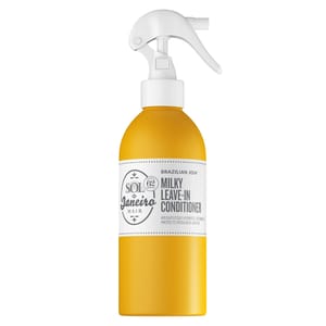Sol de Janeiro Brazilian Joia Milky Leave-In Conditioner in a yellow spray bottle hydrates, detangles, and protects hair from heat and UV damage. Contains nourishing ingredients for hair care.