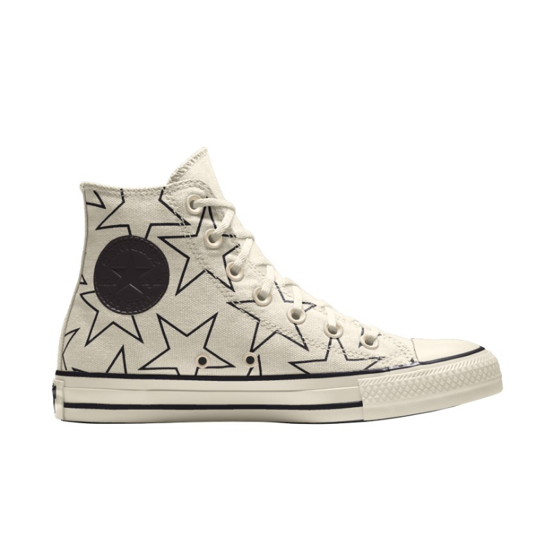 High-top Chuck Taylor All Star sneakers with a cream base featuring black star graphics and circular logo on the ankle.
