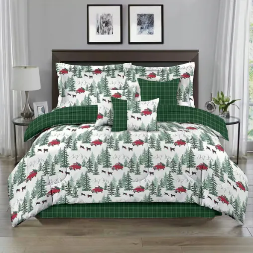 A bedding set with a woodland theme, featuring green plaid patterns and designs of red trucks, trees, and black bears. The set includes pillows, a comforter, and a bed skirt.