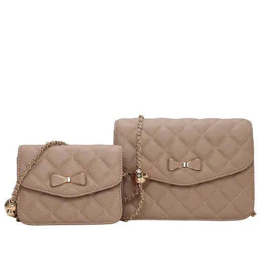 Two quilted handbags in a light brown color, featuring bow decorations and gold chain straps. One is larger and the other smaller, both with a similar design.