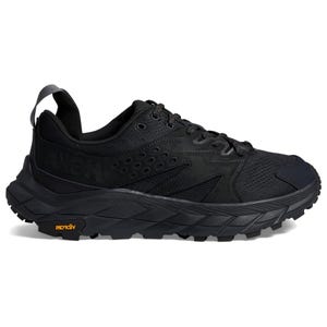 Black athletic shoe with a textured design and chunky sole.