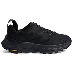 Black athletic shoe with a textured design and chunky sole.