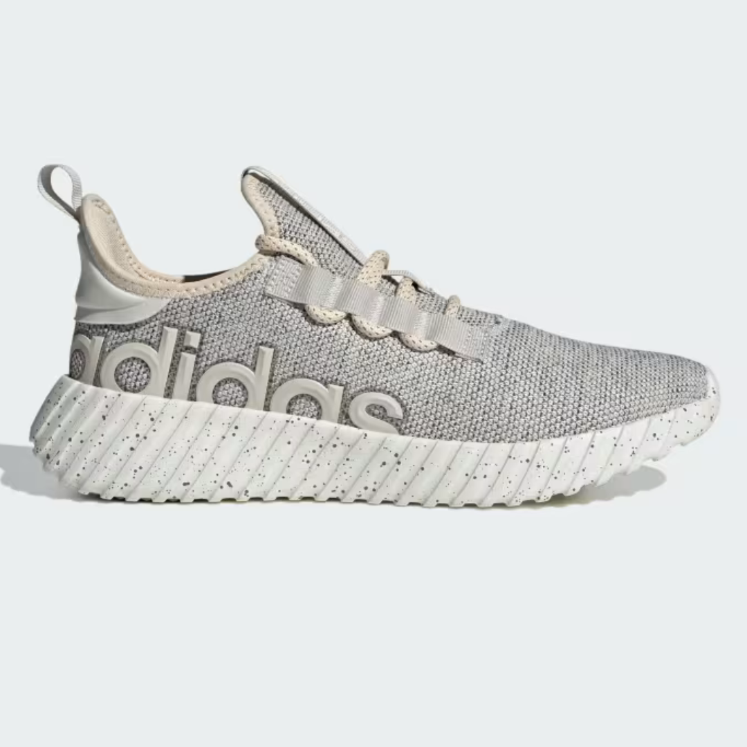 A gray Adidas sneaker with a chunky white sole and the brand's name on the side.