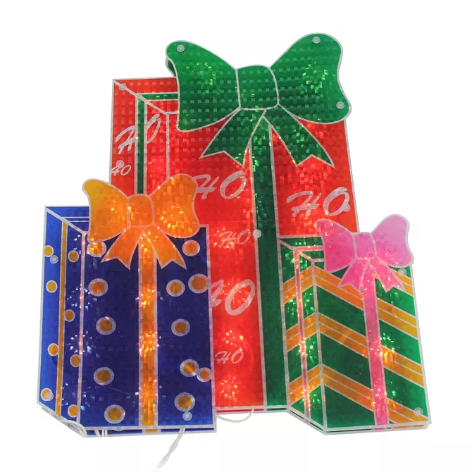 Three stacked illuminated gift boxes with bows; one is red with a green bow, another is blue with an orange bow, and the third is green with a pink bow.