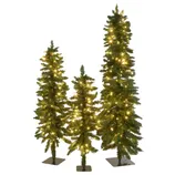 A group of three artificial Christmas trees with warm white lights on flat bases. The trees vary in height, creating a tiered appearance.