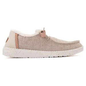 Casual slip-on shoe with a textured beige upper, faux fur lining, and speckled white sole.