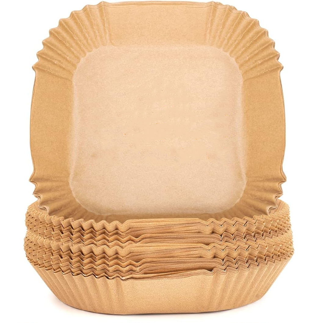 Stack of 125 brown, square-shaped parchment liners for air fryers with pleated edges for fitting into round or square baskets.