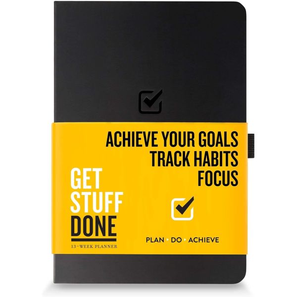 A 13-week planner titled \“Get Stuff Done\“ with a black cover and yellow band, designed to help achieve goals, track habits, and improve focus.