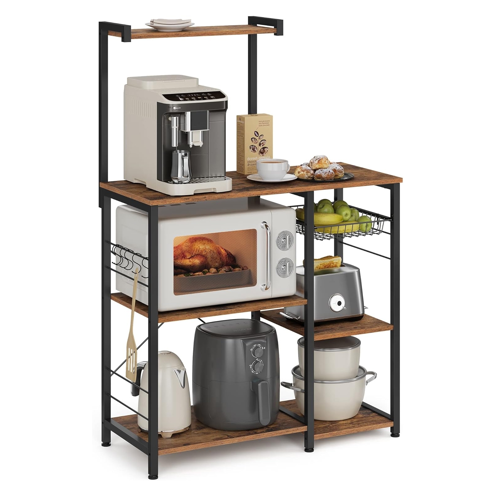 Kitchen storage rack with shelves holding a coffee maker, microwave with roast chicken inside, air fryer, toaster, kettle, and pots. Includes a basket with green apples and a plate of pastries.