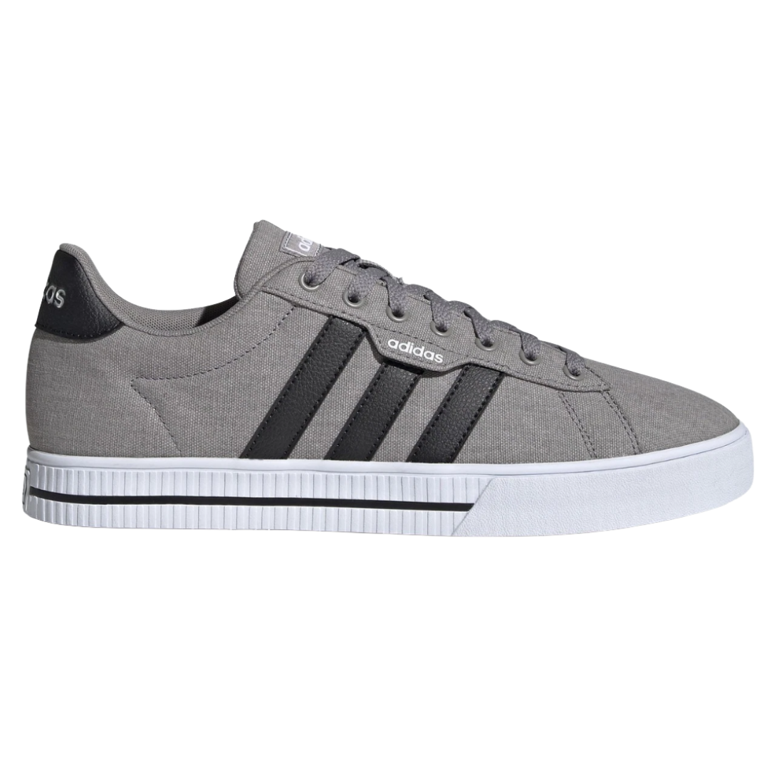 Gray Adidas sneaker with black stripes, featuring a textured upper and a white rubber sole.