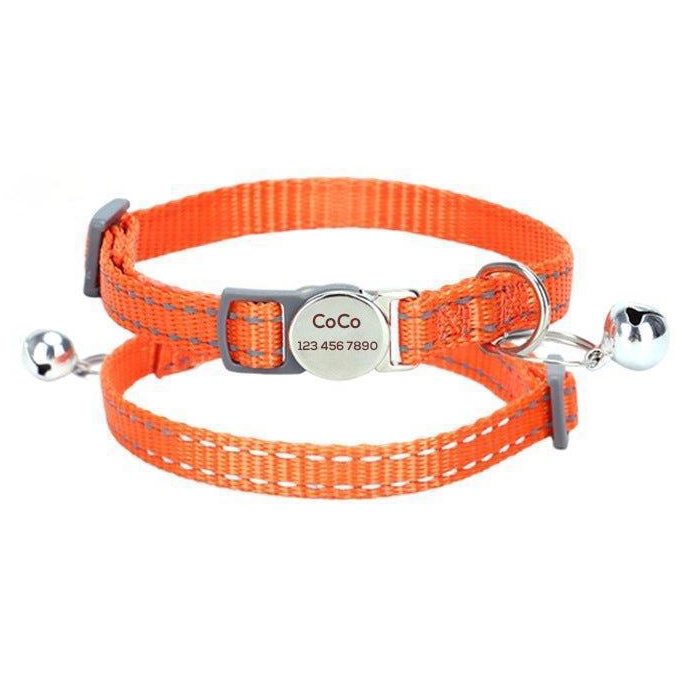 Orange adjustable pet collar with a bell and an engraved metal tag displaying \“CoCo\“ and a phone number.