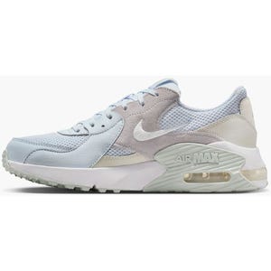 A light blue and beige Nike Air Max sneaker featuring mesh and suede materials, with a visible air unit in the sole.