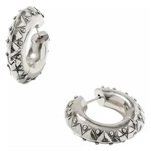 Silver-colored hoop earrings with a textured design of pyramid-shaped studs and small round accents.