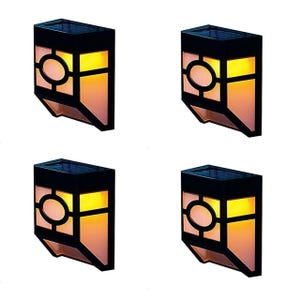 4-pack of LED solar patio fence lights with a geometric black frame and warm, amber glow. Designed for outdoor use, they automatically illuminate at night using solar power.