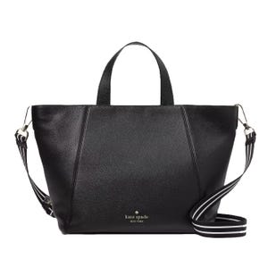 A black Kate Spade tote bag with dual handles and a detachable striped shoulder strap.