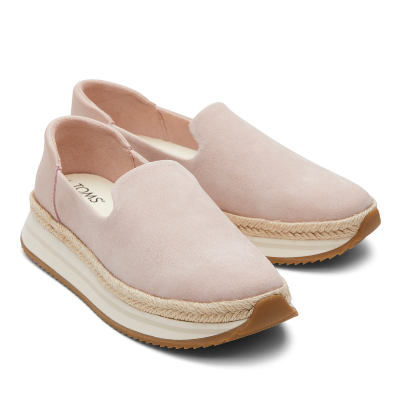Pink slip-on shoes with a platform sole, featuring a braided detail and a gum outsole.