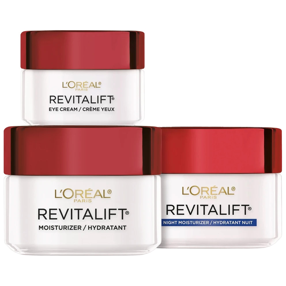L'Oreal Paris Revitalift 3pc Skincare Set includes an Eye Cream, a Moisturizer, and a Night Moisturizer, each with red lids and white jars, designed for hydrating and revitalizing the skin.