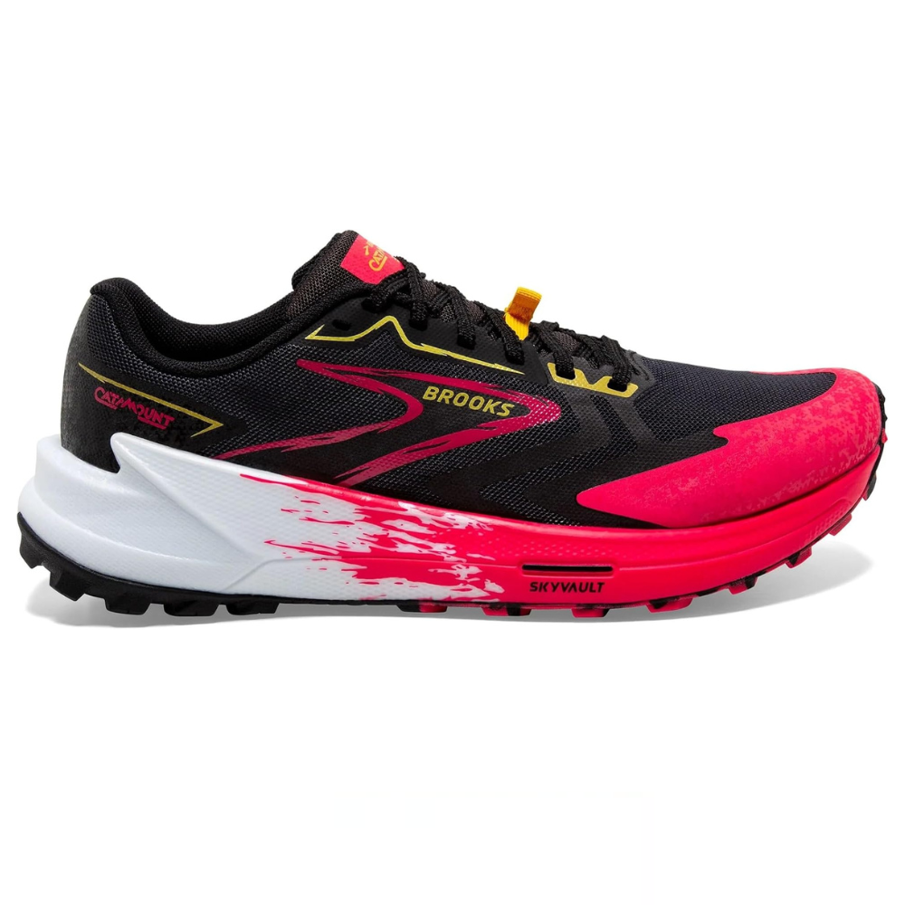 Brooks Catamount trail running shoe featuring a black upper with pink and yellow accents, a white midsole, and a pink outsole.