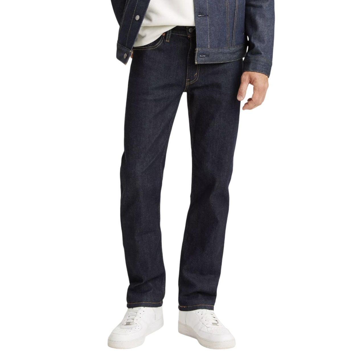 Dark denim jeans paired with a matching denim jacket and white sneakers.