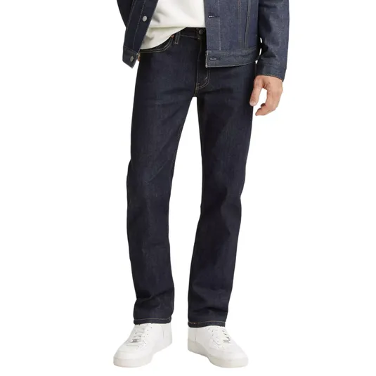 Dark denim jeans paired with a matching denim jacket and white sneakers.