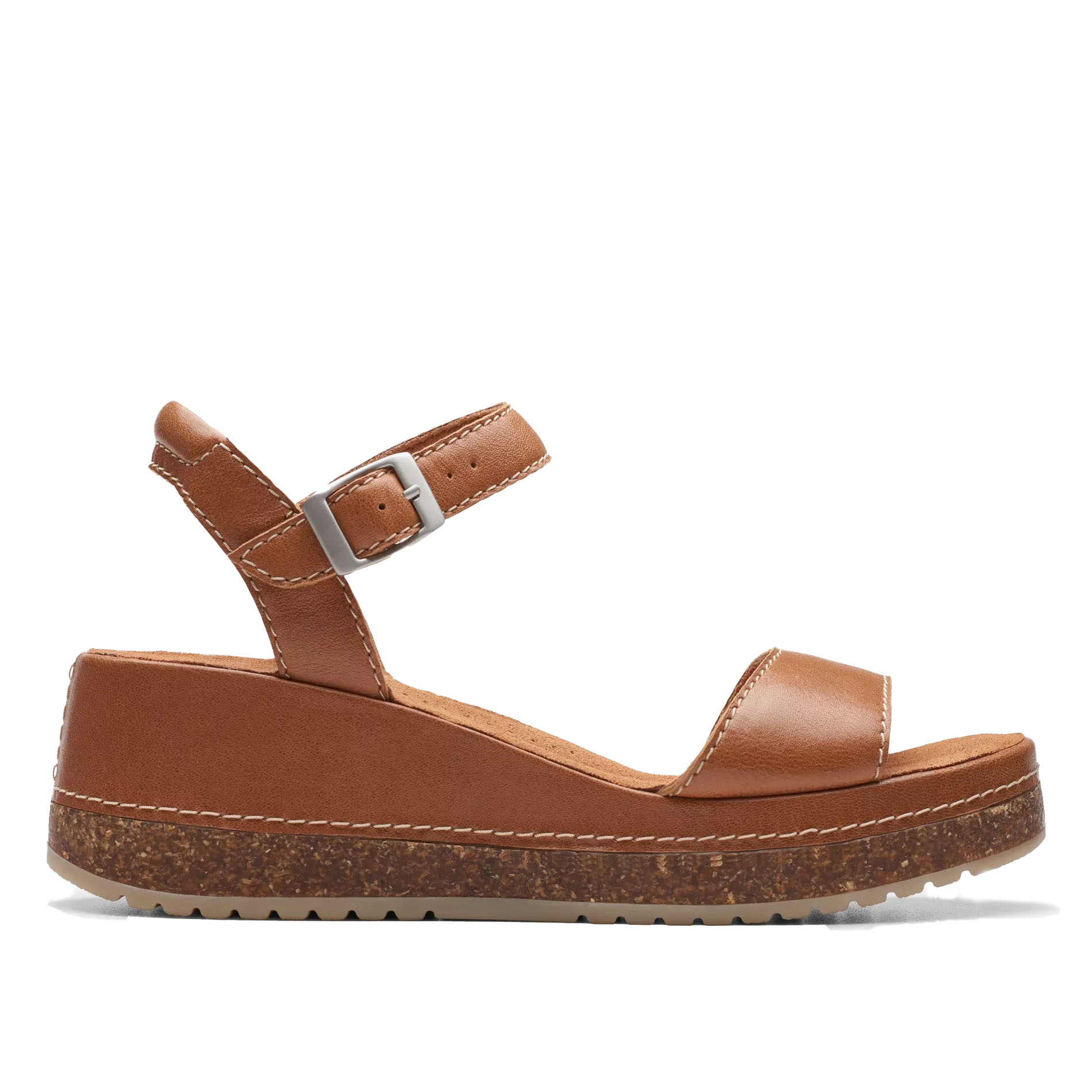 Brown wedge sandal with an ankle strap buckle, featuring stitching details and a cork-textured sole.