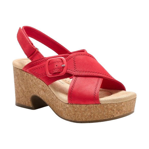 Red Clarks wedges featuring a cork heel, adjustable slingback strap with a buckle, and crisscross leather straps over the open-toe design.