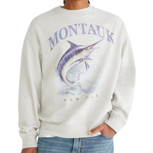 Gray sweatshirt with \“Montauk\“ in large letters and an illustration of a jumping marlin, with \“New York\“ written beneath.