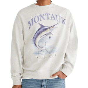 Gray sweatshirt with \“Montauk\“ in large letters and an illustration of a jumping marlin, with \“New York\“ written beneath.