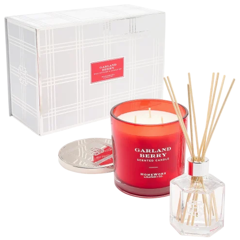 Red scented candle labeled \“Garland Berry\“ with a silver lid, accompanied by a reed diffuser in a clear bottle. Both are presented in a plaid-patterned box.