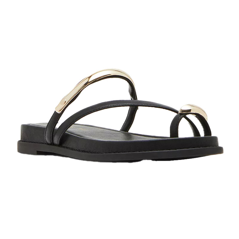 Black sandal with minimalist strappy design and metallic accents on the straps, flat sole.