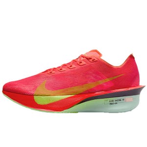 A bright pink athletic running shoe with an orange and yellow swoosh design, featuring a visibly thick sole and aerodynamic design elements for road racing.