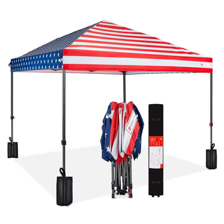 An American flag-themed canopy with a folded version and a storage bag beside it.