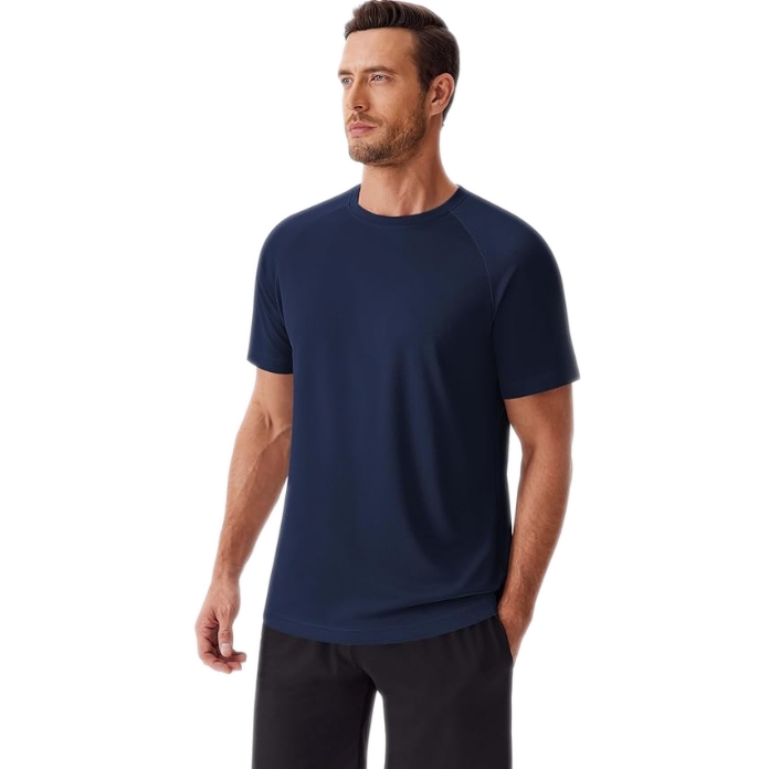 A man wears a navy athletic T-shirt with short sleeves, a crew neck, and a relaxed fit. The shirt is paired with black shorts, showcasing a comfortable, sporty look.
