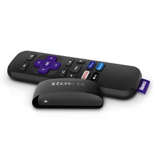 A Roku Express streaming media player with a remote control and an antenna extension for improved wireless reception. The remote has dedicated service buttons for quick access.