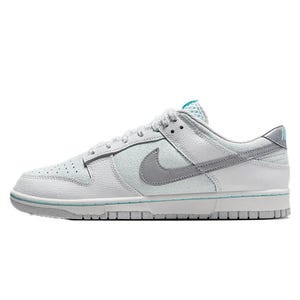 The Nike Dunk Low Retro Shoes feature a low-cut silhouette with white and light gray leather overlays, a perforated toe box, and a gray Swoosh. They have a padded tongue and collar with a teal accent, offering a stylish and comfortable fit.