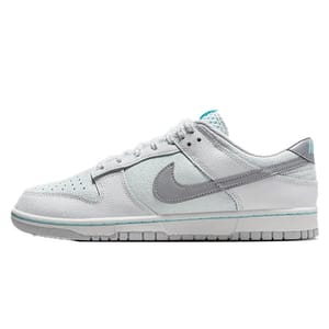 The Nike Dunk Low Retro Shoes feature a low-cut silhouette with white and light gray leather overlays, a perforated toe box, and a gray Swoosh. They have a padded tongue and collar with a teal accent, offering a stylish and comfortable fit.