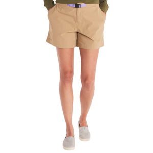 Beige shorts with an integrated black belt, paired with a green top and gray slip-on shoes.