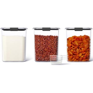 3pk Rubbermaid Brilliance Pantry Set includes three clear containers with secure black lids, storing flour, kidney beans, and dried apricots, accompanied by clear plastic scoops for easy dispensing.
