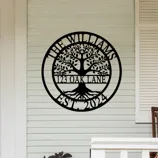 Metal wall sign featuring a tree design with text \“The Williams, 123 Oak Lane, Est. 2024\“ displayed on a house exterior.
