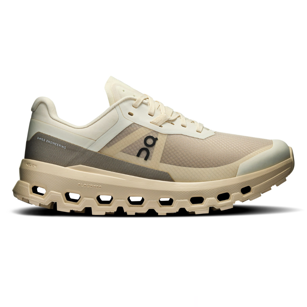 A beige running shoe with visible \“Swiss Engineering\“ text and distinctive CloudTec sole, featuring lace-up closure and minimalist design.