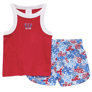Red tank top with \“USA EST. 1776\“ lettering, paired with floral-patterned blue, white, and red shorts.