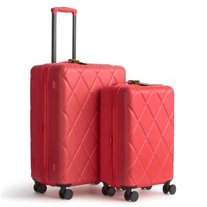 Two red suitcases with a quilted pattern, featuring telescopic handles and four wheels for easy mobility.