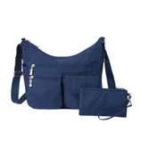 A blue crossbody bag with multiple zippered compartments and an adjustable strap, accompanied by a matching wristlet pouch.