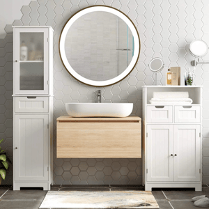 Modern bathroom setting with a wooden floating vanity, white ceramic vessel sink, circular LED mirror, hexagonal tile wall, and white cabinets for storage.