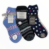 Three pairs of cozy, soft, and warm socks from Ellen Tracy, Nine West, and Jones New York, each with unique patterns: blue with purple stripes, black and gray stripes, and navy with pink and white polka dots.
