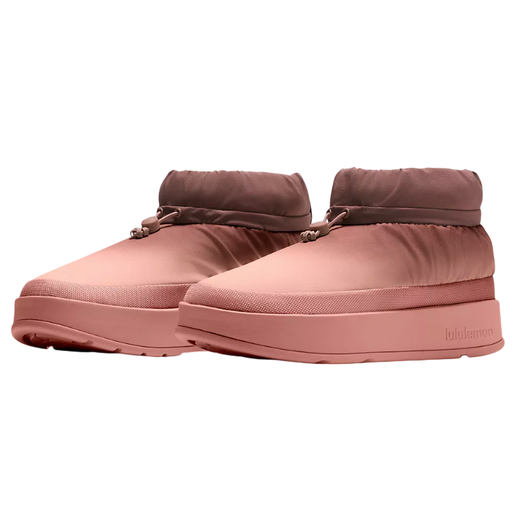 A pair of pink, cushioned slip-on shoes with a drawstring at the top and a platform sole, featuring the lululemon logo on the side.