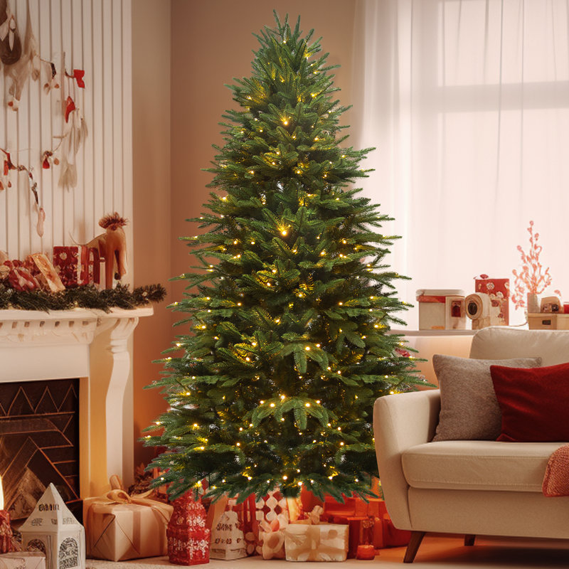 A Christmas tree adorned with warm white LED lights is set up in a cozy living room, surrounded by wrapped gifts. Part of the room's festive decor includes stockings and decorative elements by the fireplace.