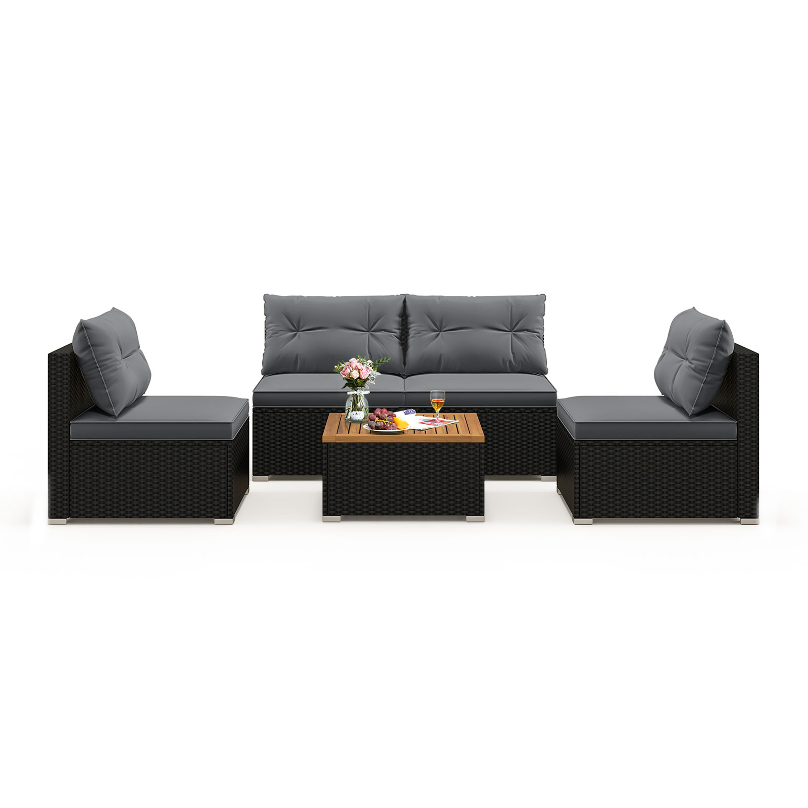 Outdoor patio furniture set with gray cushions, featuring a three-seater sofa, two single chairs, and a coffee table with a wooden top, decorated with flowers, fruit, and drinks.