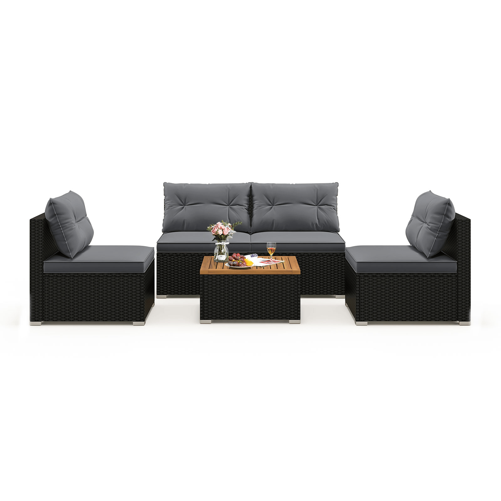 Outdoor patio furniture set with gray cushions, featuring a three-seater sofa, two single chairs, and a coffee table with a wooden top, decorated with flowers, fruit, and drinks.